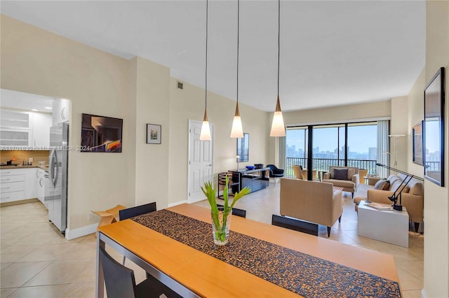 dining space featuring light tile patterned floors