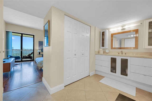 bathroom featuring hardwood / wood-style flooring and vanity