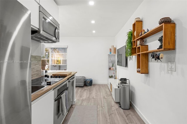 kitchen featuring stainless steel appliances and light wood-type flooring