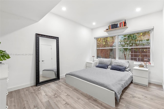 bedroom with light wood-type flooring