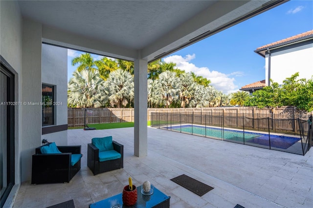 view of patio / terrace with a fenced in pool