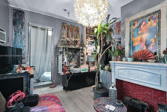 miscellaneous room featuring a chandelier and light hardwood / wood-style flooring