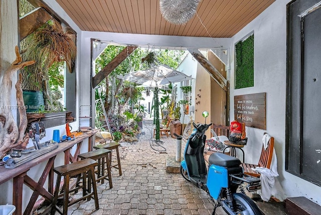 sunroom / solarium with wood ceiling