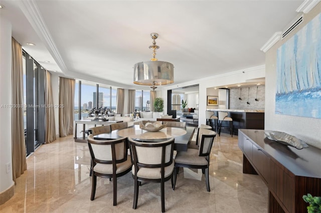 dining space featuring ornamental molding