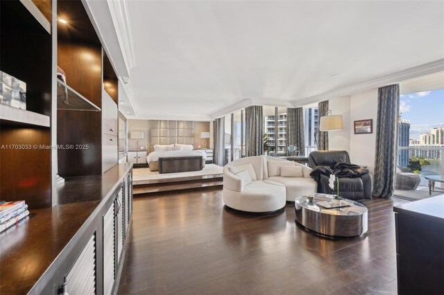 living room featuring ornamental molding, dark wood-type flooring, a wall of windows, and a healthy amount of sunlight