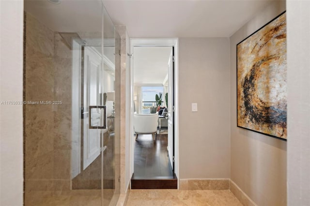 bathroom with tile patterned flooring and a shower with shower door