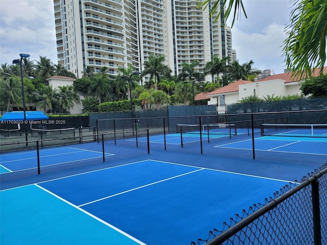 view of tennis court featuring basketball court