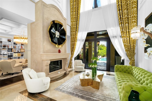 5935 Moss Ranch Rd, Pinecrest, FL 33156 - tiled living room with a chandelier, coffered ceiling, a high ceiling, a premium fireplace, and beam ceiling