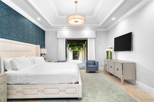 tiled bedroom featuring crown molding and a tray ceiling