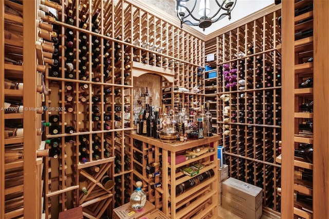 5935 Moss Ranch Rd, Pinecrest, FL 33156 - wine room with a chandelier