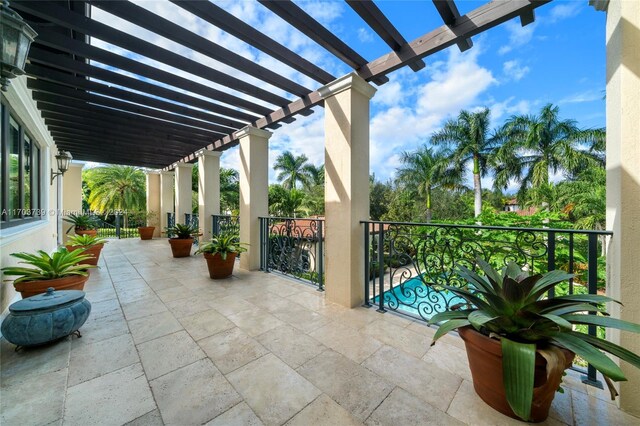 5935 Moss Ranch Rd, Pinecrest, FL 33156 - view of patio featuring a pergola