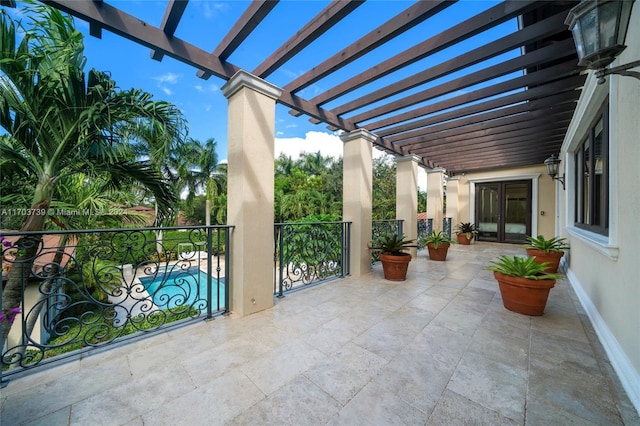 view of patio / terrace with french doors and a pergola