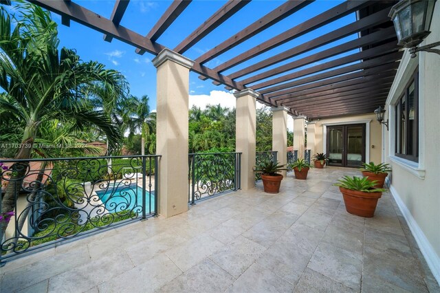 5935 Moss Ranch Rd, Pinecrest, FL 33156 - view of patio with a pergola and french doors