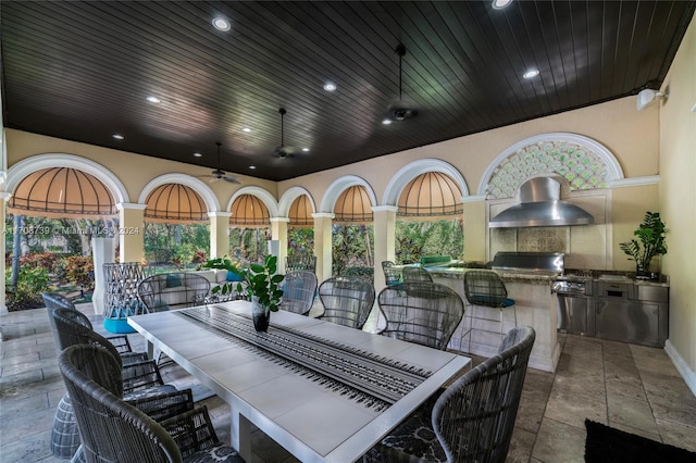 view of patio featuring area for grilling, ceiling fan, and a grill