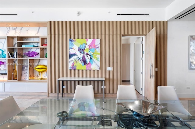 dining room featuring visible vents