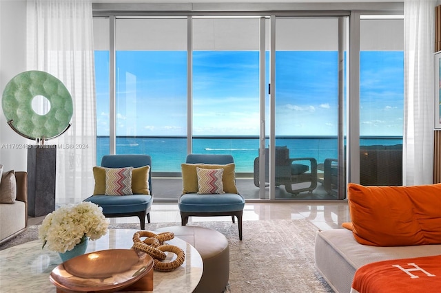 living room featuring a water view and a wealth of natural light