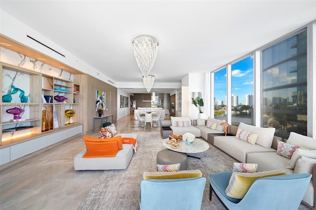 living area with a wall of windows, a city view, and a notable chandelier