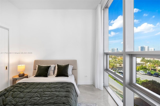 bedroom featuring a city view