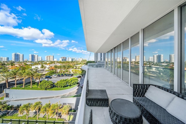 balcony featuring a view of city and outdoor lounge area