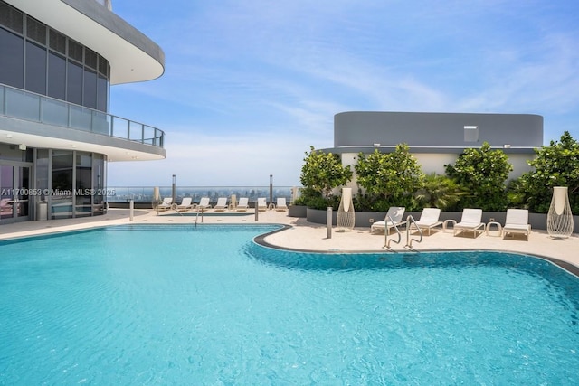 view of swimming pool featuring a patio