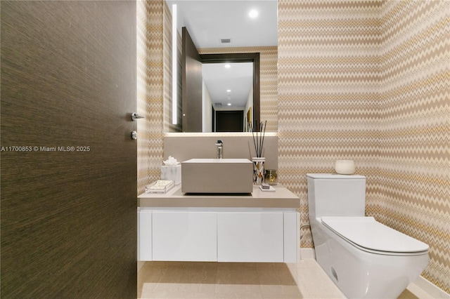 bathroom with vanity and toilet