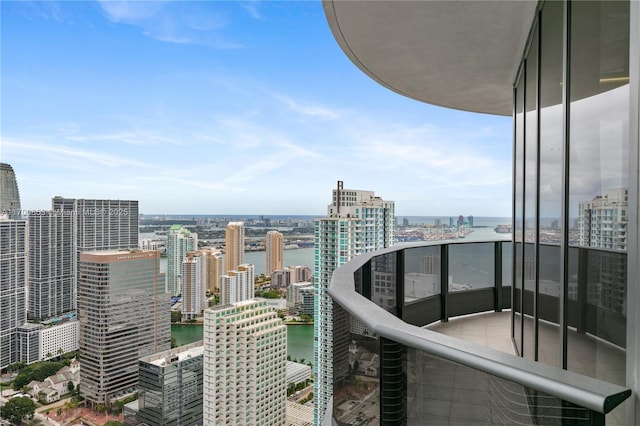 balcony featuring a water view