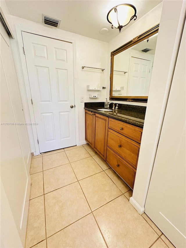 bathroom with vanity and tile patterned floors