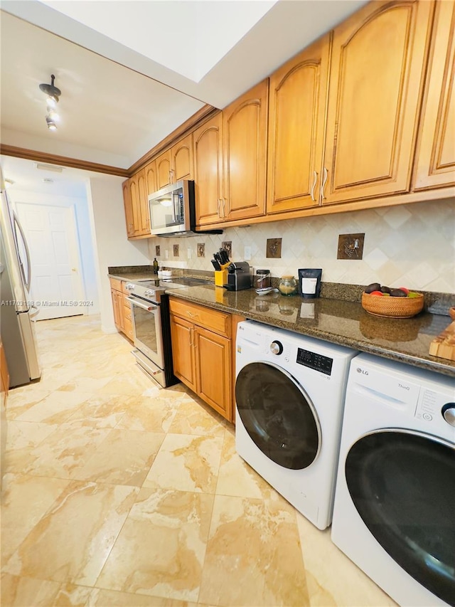 laundry area with washing machine and dryer