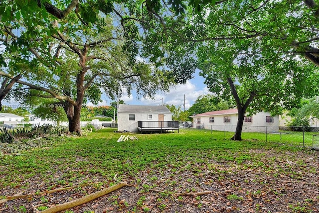 view of yard featuring a wooden deck