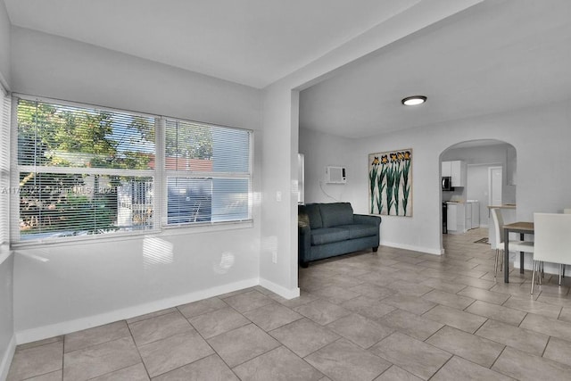 unfurnished room with light tile patterned floors