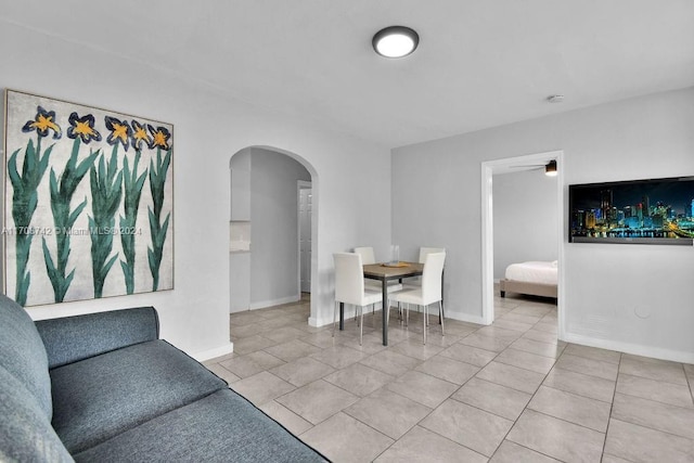 dining space featuring tile patterned floors and ceiling fan