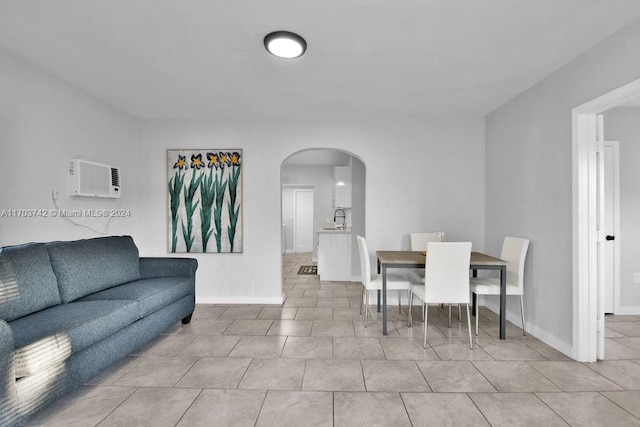 tiled living room with a wall unit AC