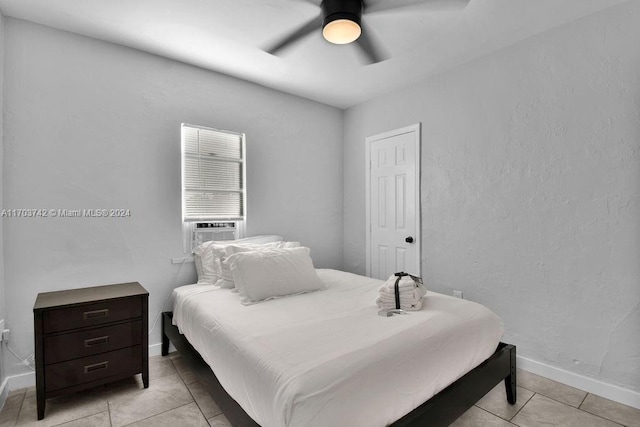 tiled bedroom featuring ceiling fan and cooling unit