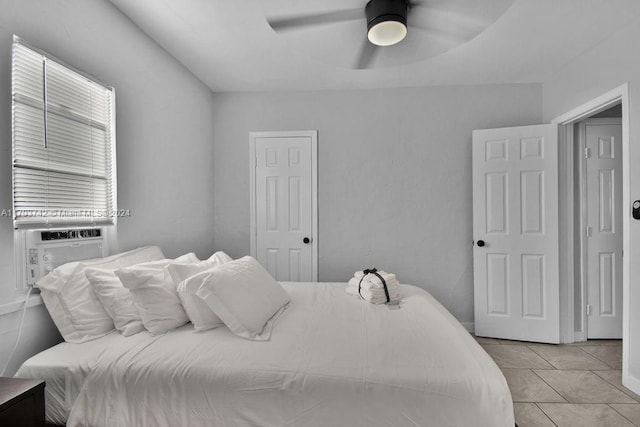 bedroom featuring ceiling fan and light tile patterned flooring