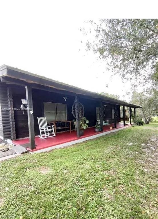 exterior space featuring a patio area and a yard