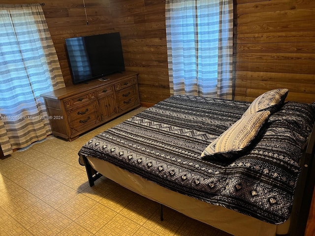 bedroom with wooden walls