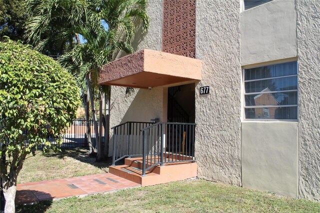 677 SW 9th Ave Unit 103, Miami, FL 33130 - property entrance featuring stucco siding