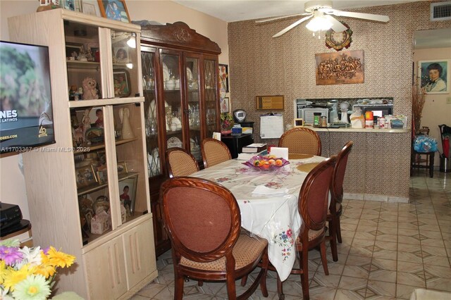 677 SW 9th Ave Unit 103, Miami, FL 33130 - tiled dining area featuring a ceiling fan