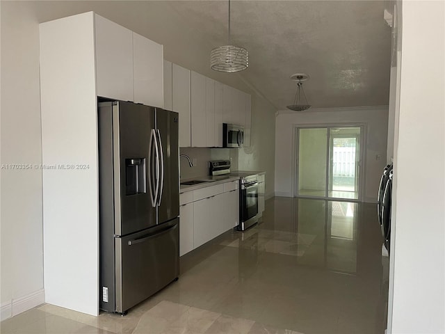 kitchen featuring white cabinets, sink, hanging light fixtures, a textured ceiling, and appliances with stainless steel finishes