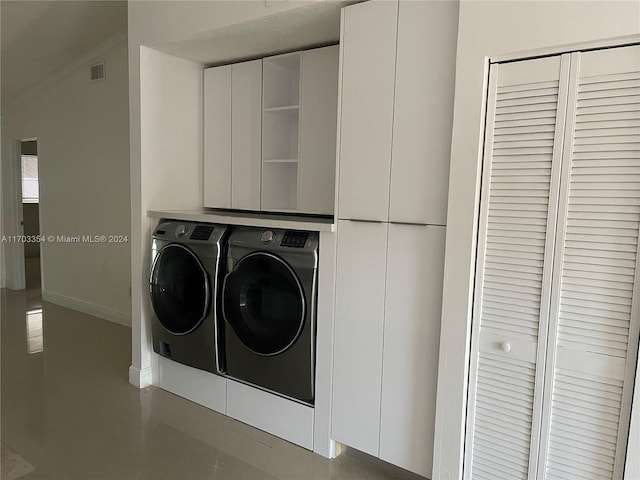 clothes washing area with independent washer and dryer