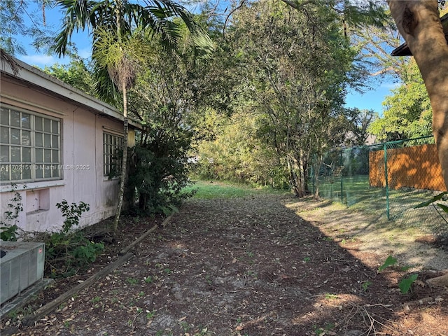 view of yard featuring central air condition unit