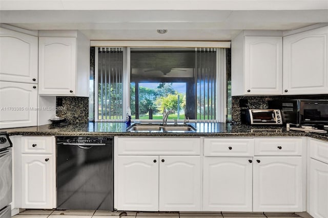 kitchen with sink, white cabinets, dark stone counters, and black dishwasher