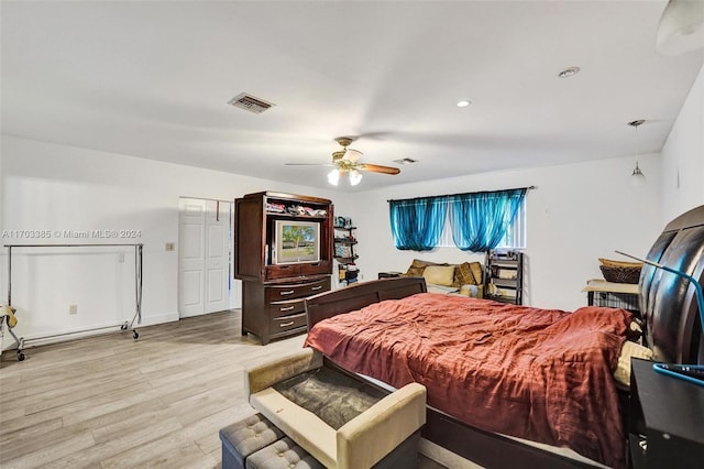 bedroom featuring ceiling fan and light hardwood / wood-style flooring