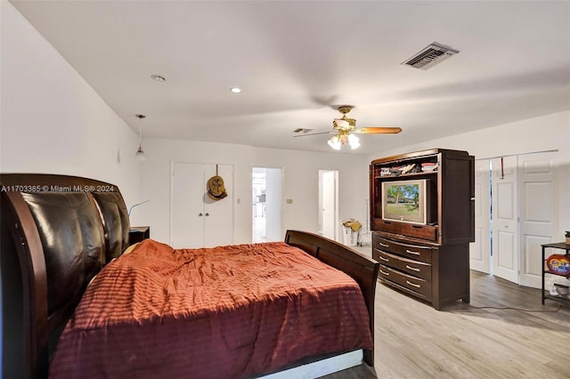 bedroom featuring wood-type flooring and ceiling fan