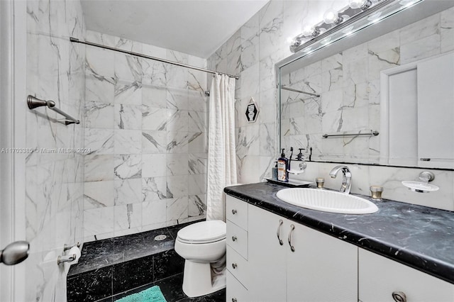 bathroom with vanity, backsplash, toilet, tile walls, and walk in shower