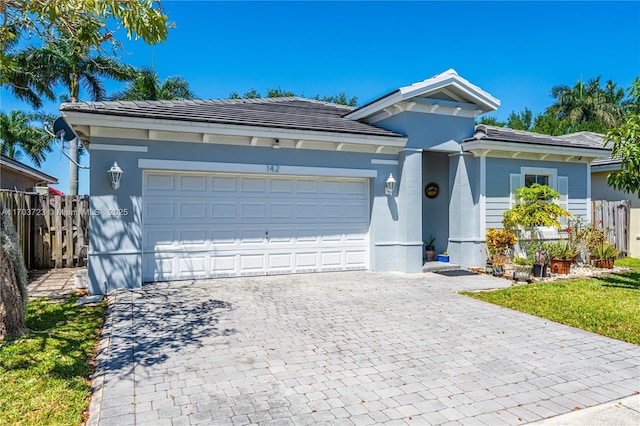 single story home with a garage