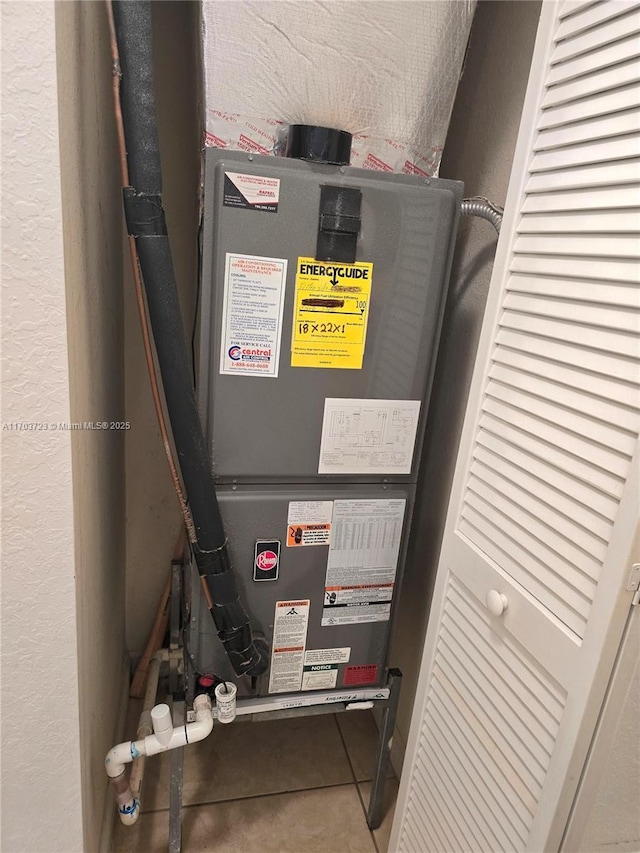 utility room with heating unit