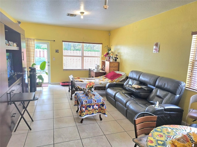 tiled living room with a textured ceiling