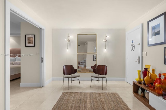 living area with light tile patterned floors and ornamental molding