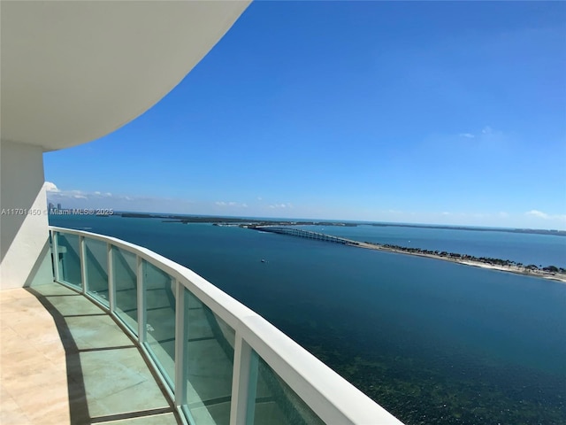 balcony featuring a water view